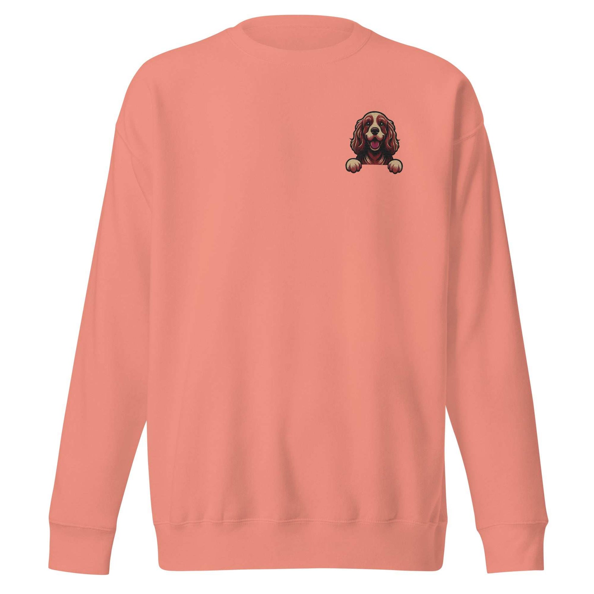 Unisex coral sweatshirt with detailed embroidered Cocker Spaniel dog design on chest, made of soft cotton blend fabric.