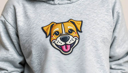 Gray sweatshirt with embroidered happy dog face showcasing pet's personality