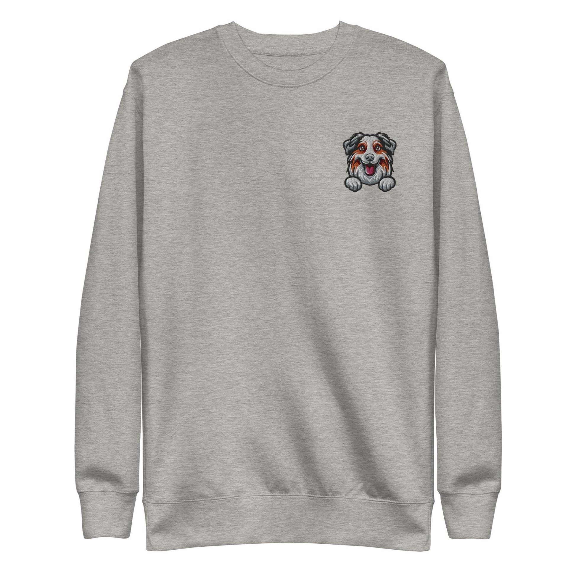 Grey unisex sweatshirt with embroidered Australian Shepherd dog face on chest, made of soft cotton-polyester blend fabric.