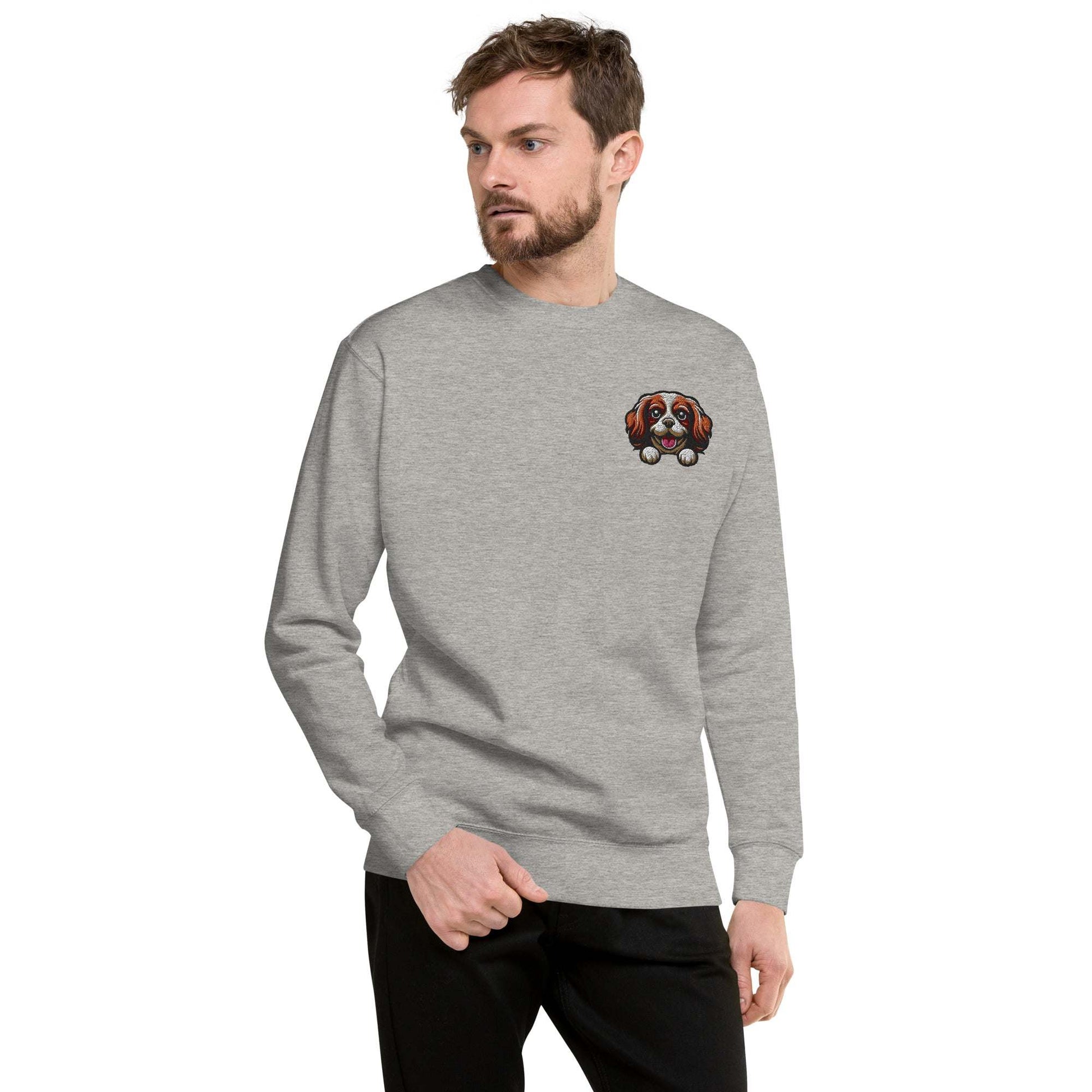 Unisex premium sweatshirt in gray featuring embroidered Cavalier King Charles Spaniel dog face on chest with soft cotton blend fabric and ribbed cuffs.