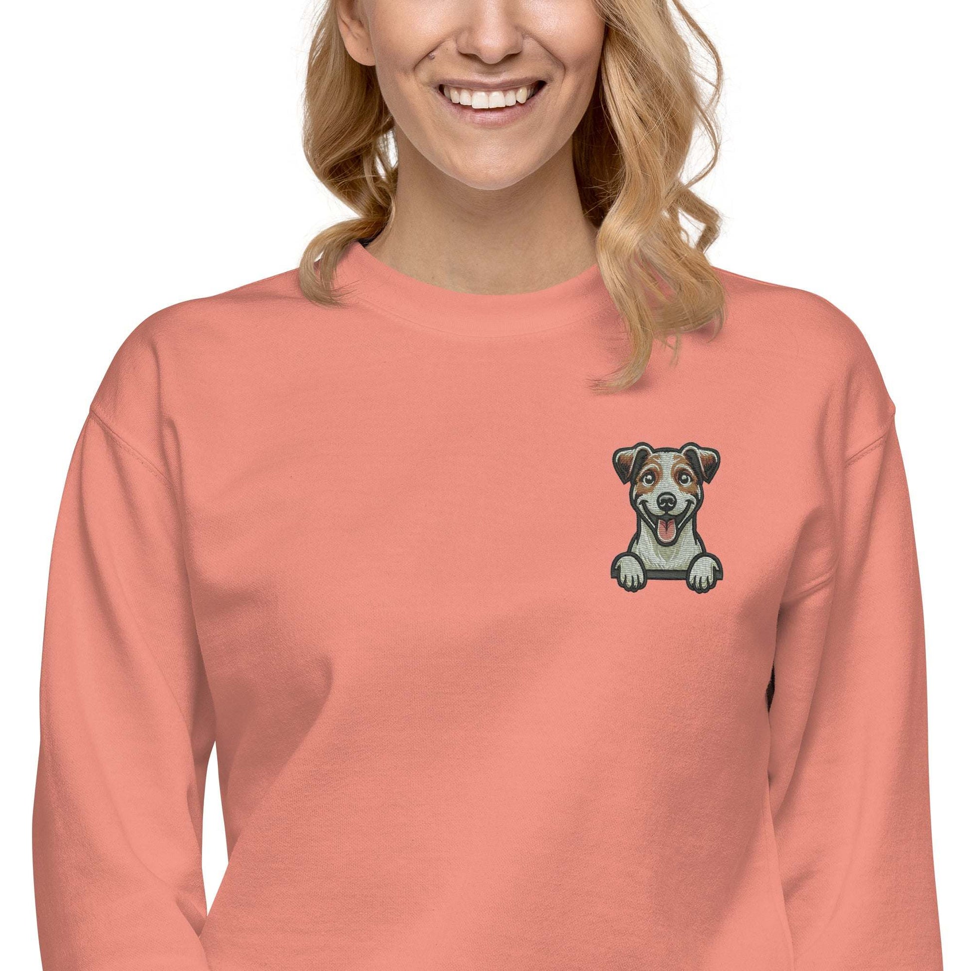 Unisex coral sweatshirt with embroidered playful Jack Russell dog on chest, premium soft fabric, and cozy fleece interior