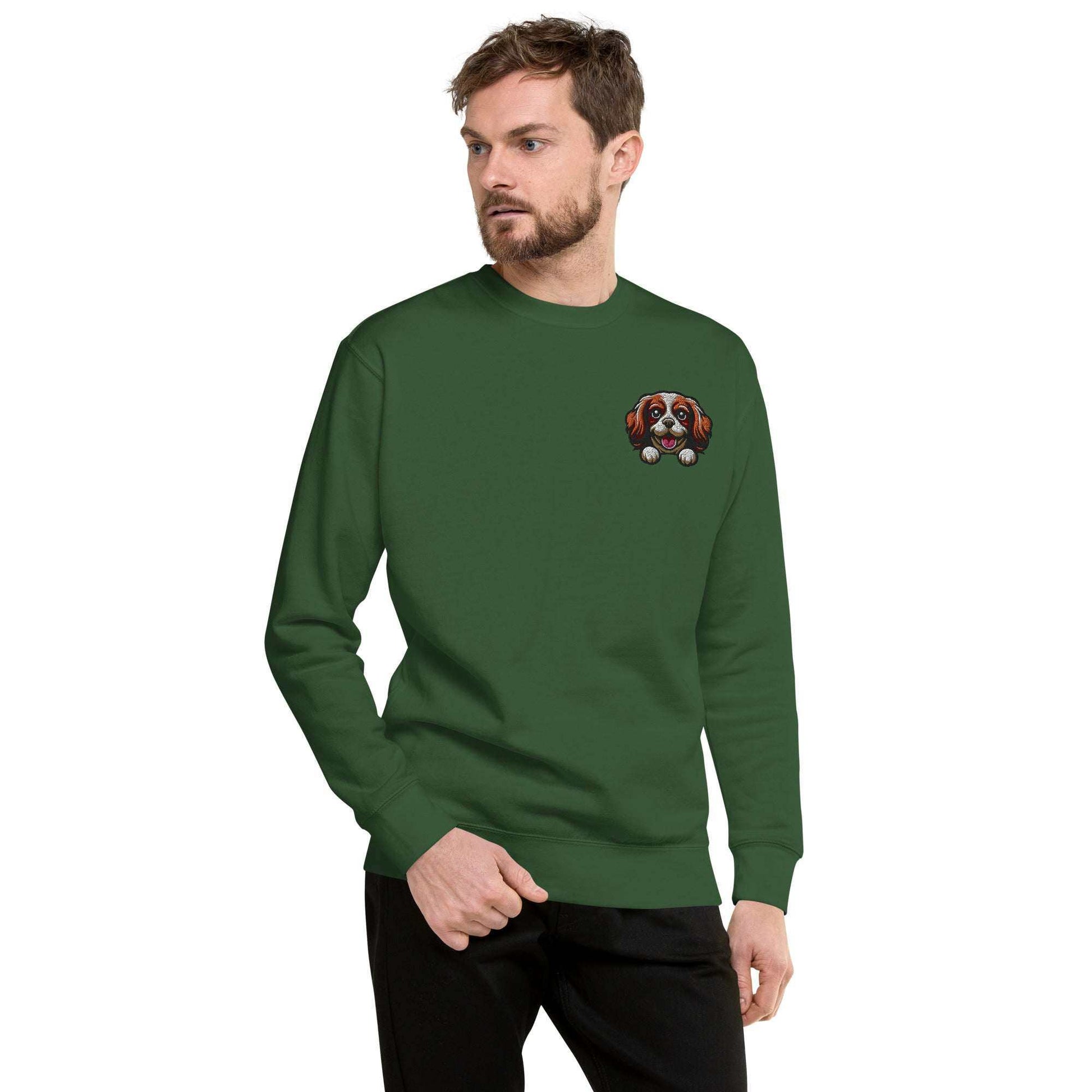 Unisex green sweatshirt featuring embroidered Cavalier King Charles Spaniel dog face on chest, made from soft cotton blend fabric.