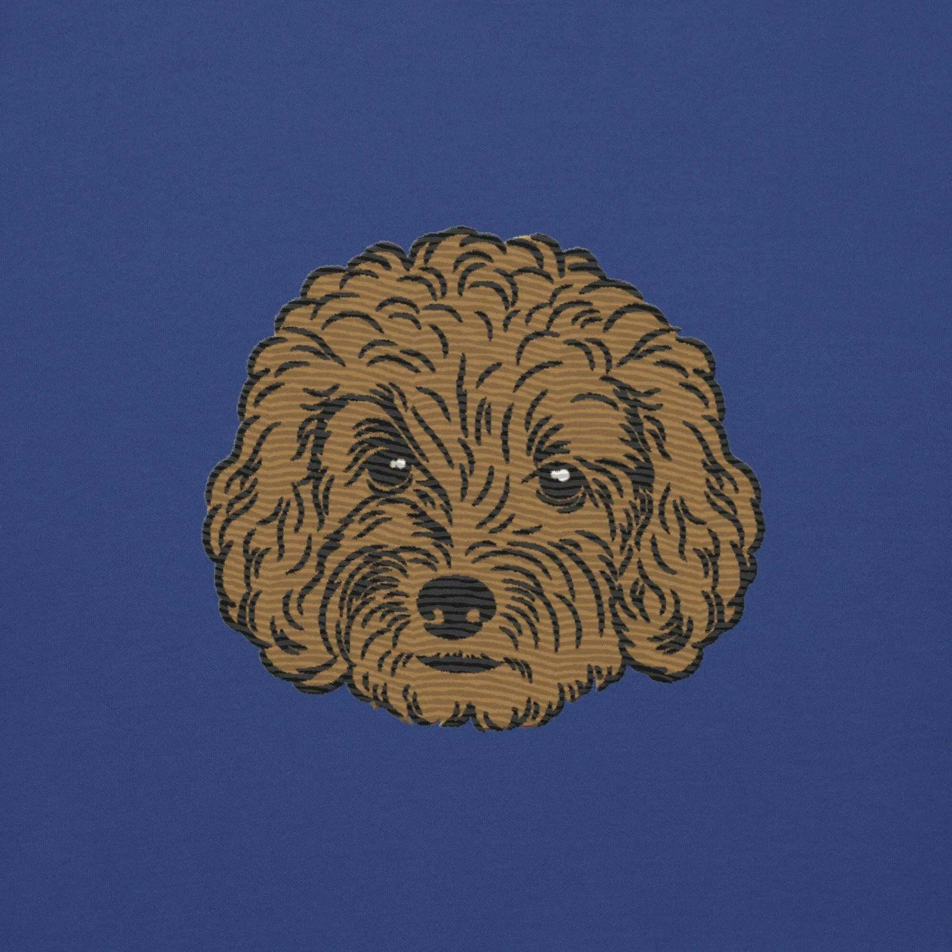 Close-up of detailed poodle embroidery on a premium unisex sweatshirt in blue.