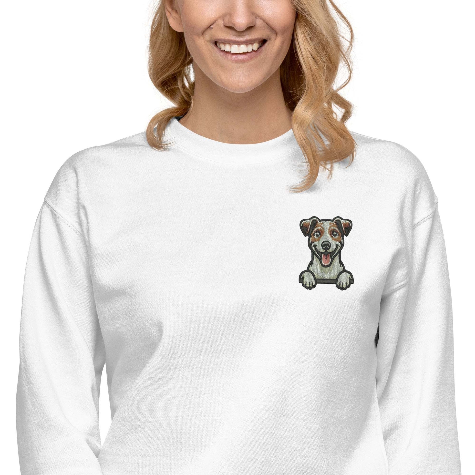 White unisex sweatshirt featuring detailed Jack Russell dog embroidery on the chest with a cozy, soft fabric blend.