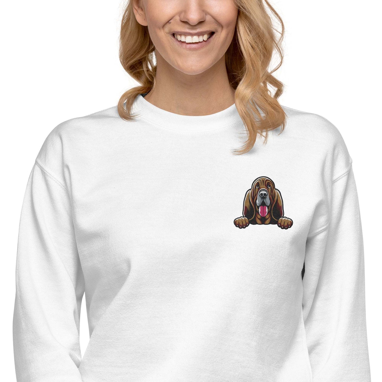 White unisex sweatshirt featuring premium embroidered Bloodhound dog design on chest, showing droopy ears and attentive expression.