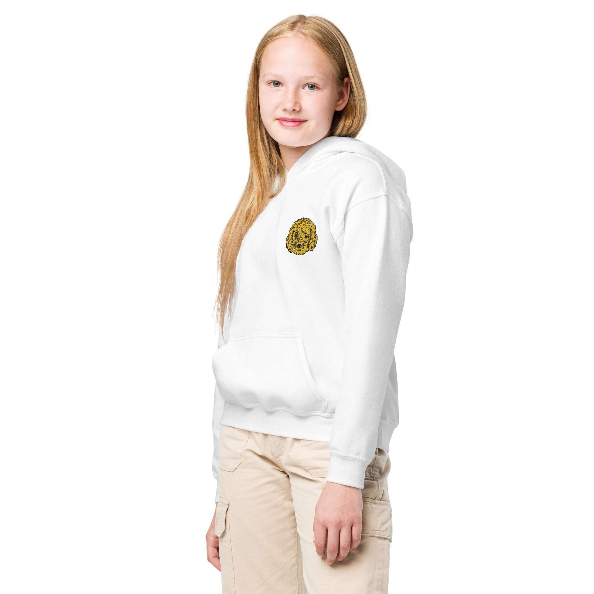 Kid wearing white premium unisex hoodie with detailed embroidered Poodle dog design on chest and front pouch pocket.